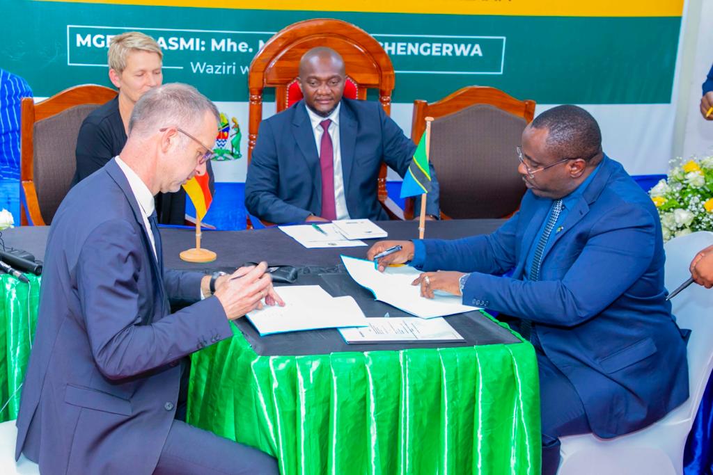 Permanent Secretary in the Ministry of Tourism and Natural Resources, Dr Hassan Abbasi (right), and the Deutsche Gesellschaft für Internationale Zusammenarbeit (GIZ) Country Director for Tanzania and the East African Community, Dr Mike Falke (left), signing the implementation agreement for the program "Mitigation of Human-Wildlife Conflicts" at the Tanzania Tourist Board (TTB) headquarters in Dar es Salaam, witnessed by the Minister for Natural Resources and Tourism, Mohamed Mchengerwa, and the Ambassador of the Federal Republic of Germany, Regine Hess